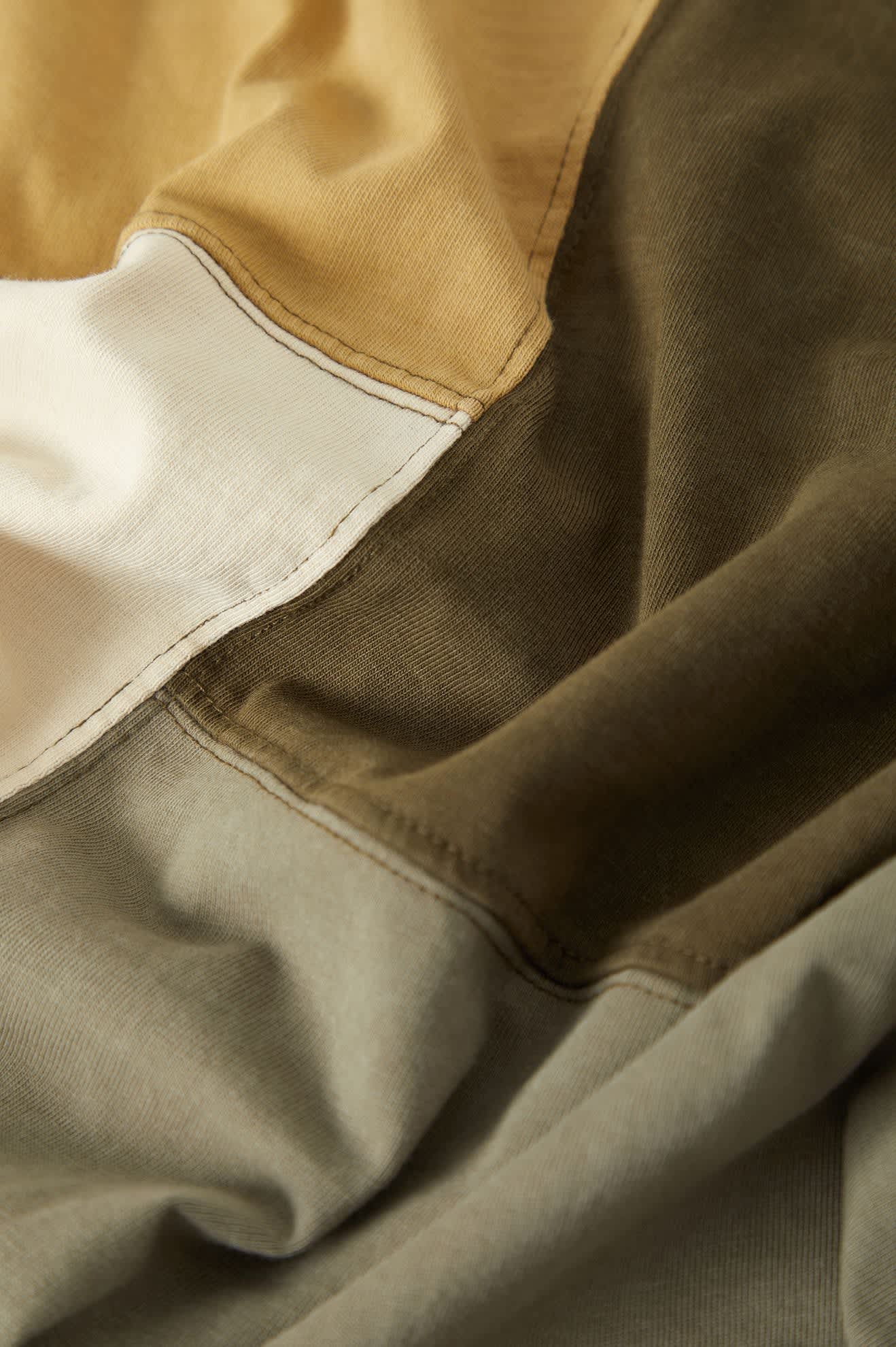 Men's Deco Relaxed Polo T-Shirt in the color Tonal Color Block - Additional Laydown image