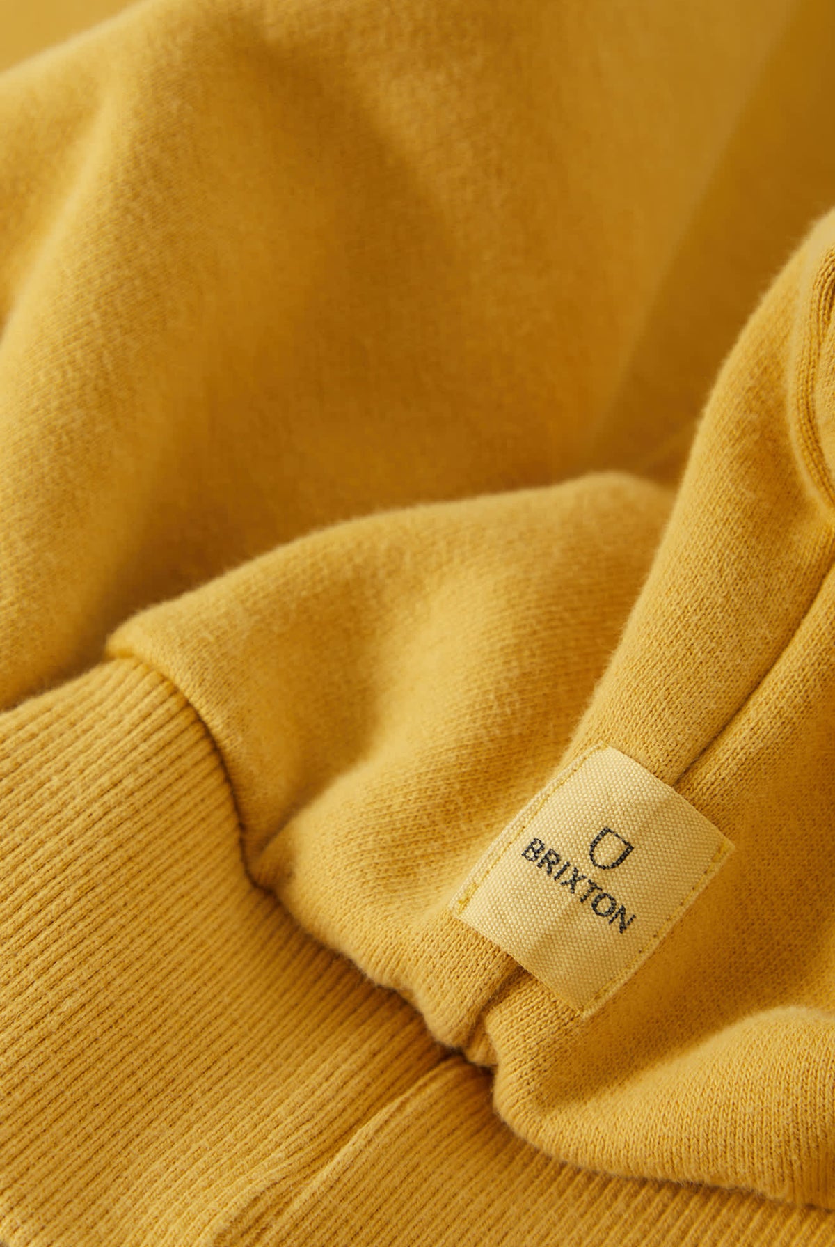 Men's Brixton Baseline Crew Fleece in the color Dusted Ochre Vintage Wash - Additional Laydown image