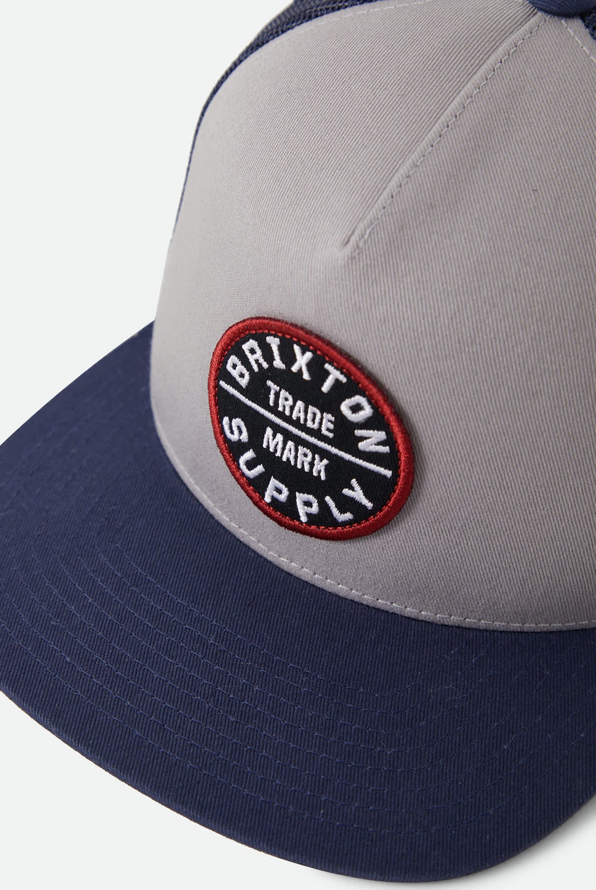 Unisex Oath Trucker Hat in the color Sustained Grey/Washed Navy - Additional Laydown image