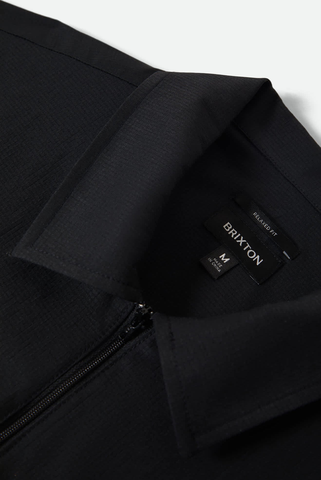 Men's Journey Lightweight 1/2 Zip Cropped Short Sleeve Shirt in the color Black - Additional Laydown image