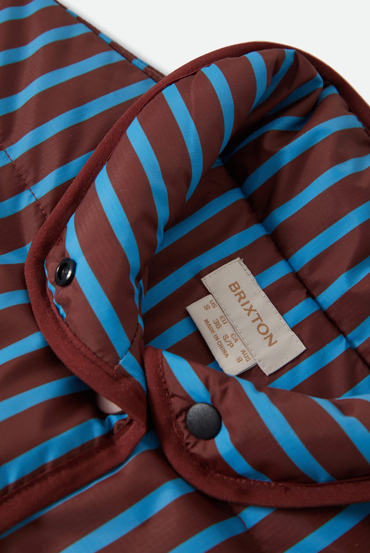 Women's Delilah Mock Neck Jacket in the color Dark Brick/Electric Indigo Stripe - Additional Laydown image