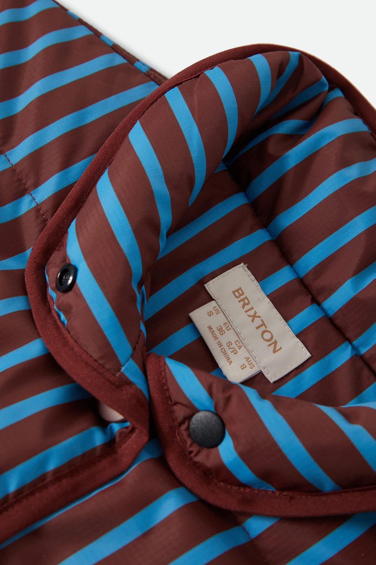Women's Delilah Mock Neck Jacket in the color Dark Brick/Electric Indigo Stripe - Additional Laydown image