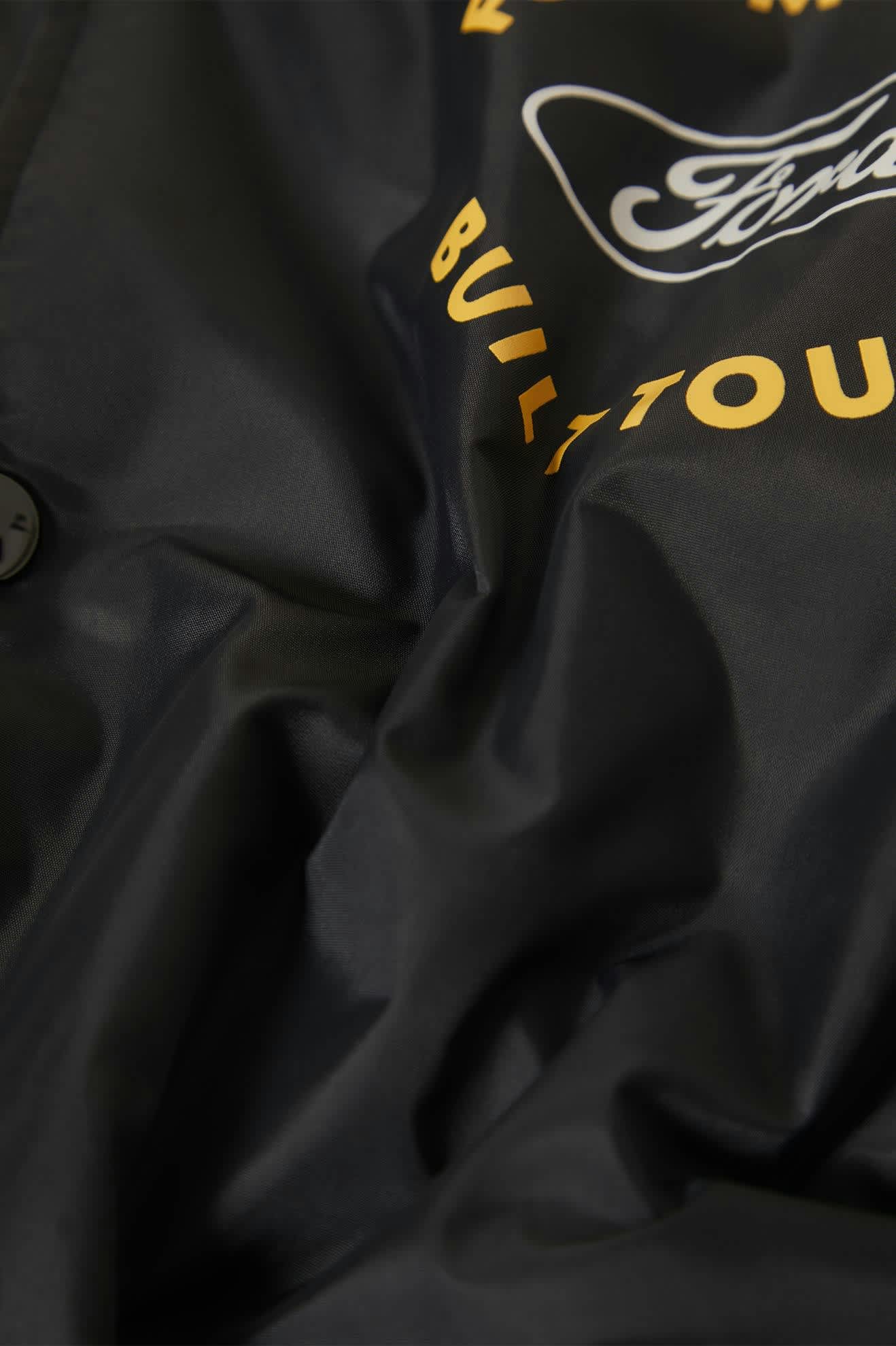 Men's Ford Built Tough Windbreaker in the color Burnt Rubber - Additional Laydown image