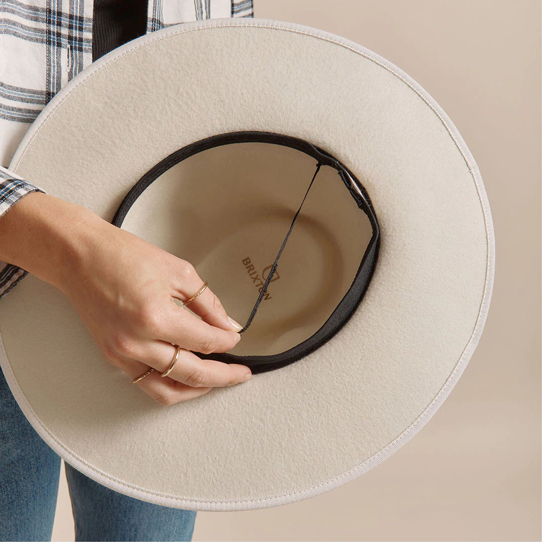 
       Most of our brims have a built-in fit adjustor. Just pull back sweatband inside the crown of the hat to reveal the adjuster tab. Pull to your liking and affix to the velcro tab. Adjust as needed for the perfect fit.
     