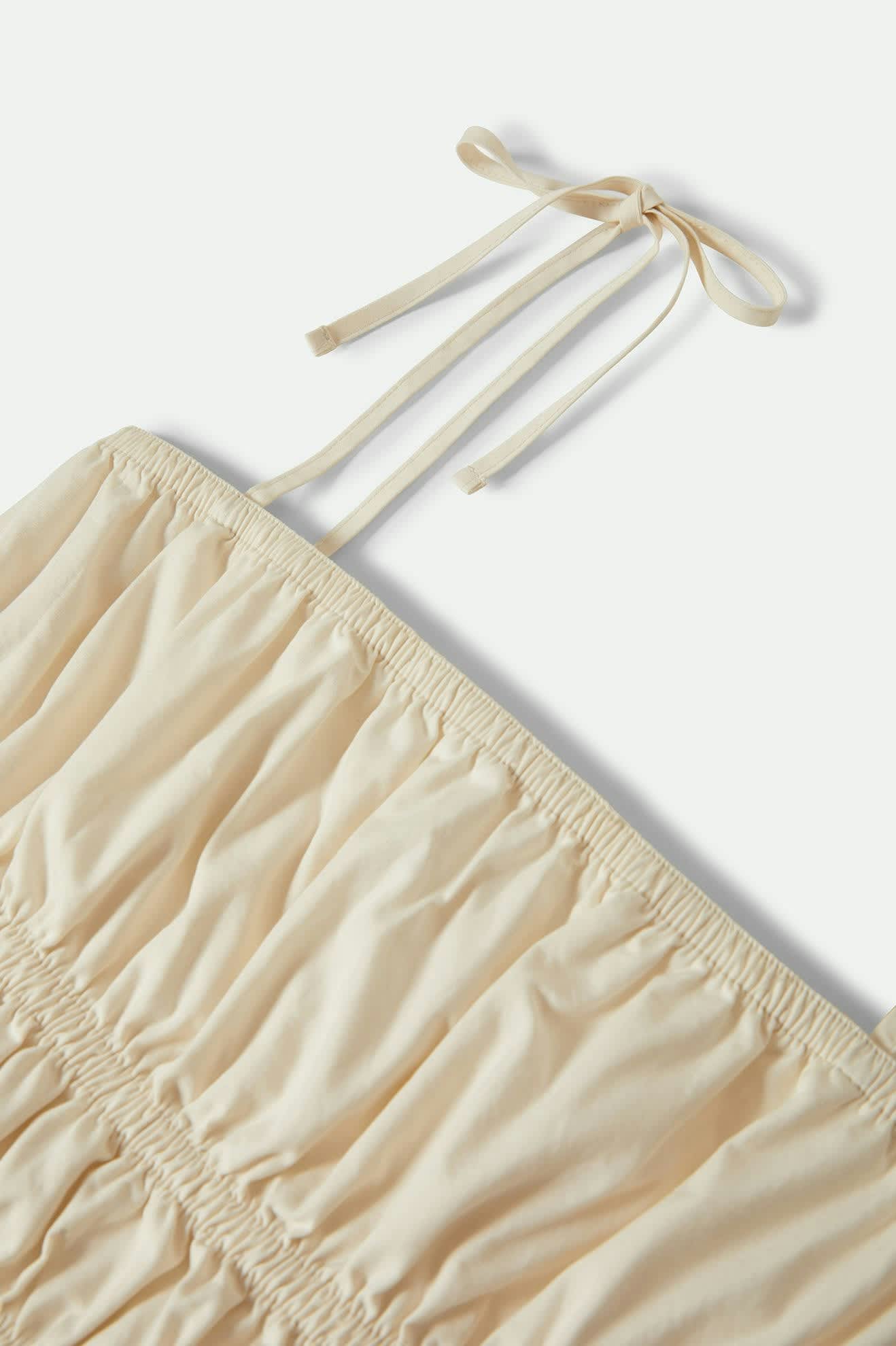 Women's Eden Smocked Top in the color Off White - Additional Laydown image