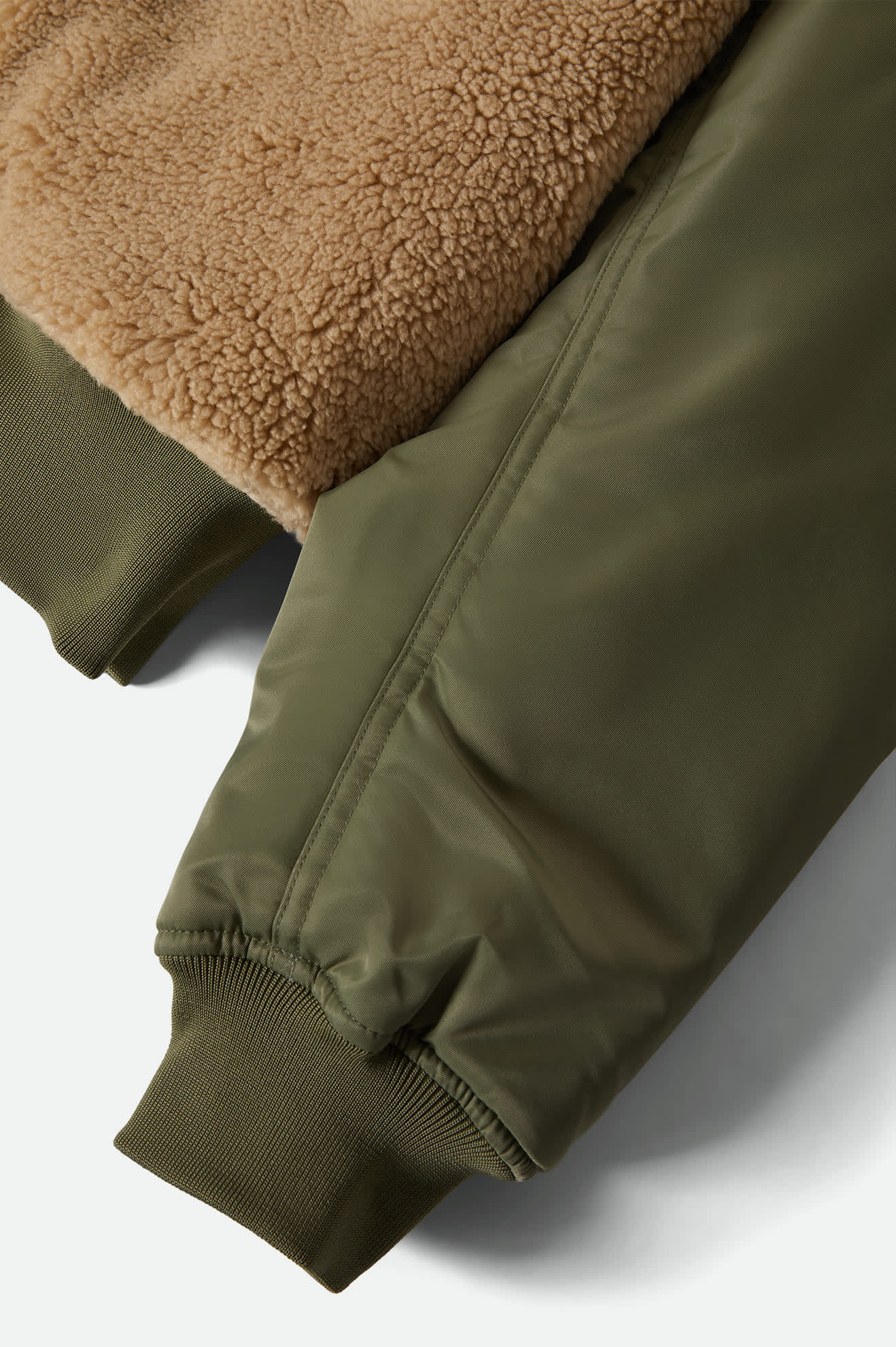 Women's Sherpa Surplus Bomber Jacket in the color Olive Surplus - Additional Laydown image