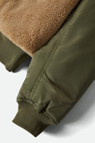 Women's Sherpa Surplus Bomber Jacket in the color Olive Surplus - Additional Laydown image