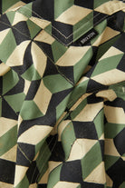 Men's Burger She Wrote Hybrid Short in the color Black/Green Tile - Additional Laydown image