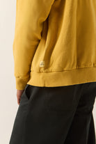 Men's Brixton Baseline Hood Fleece in the color Dusted Ochre Vintage Wash - Additional Fit image