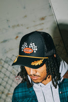 Women's Podium Netplus Trucker Hat in the color Black/Black - Men's Lifestyle image