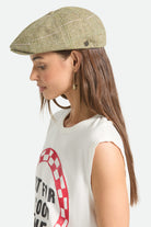 Women's Brood Lightweight Newsboy Cap in the color Sublime Green Houndstooth - Women's Side View