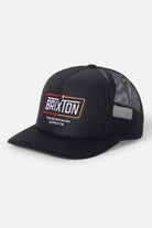 Unisex Caldwell Netplus Trucker Hat in the color Black/Black - Front Product View