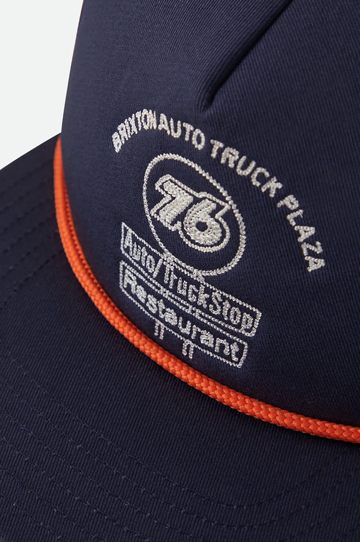 Unisex 76 Truck Stop Trucker Hat in the color Navy/Orange - Additional Laydown image