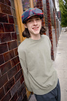 Unisex Barrel Earflap Snap Cap in the color Navy/Green/Red/Cream - Men's Lifestyle image