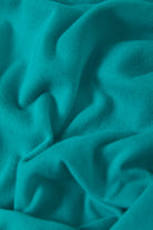 Women's Carefree Organic Garment Dye Muscle Tank in the color Retro Green - Additional Laydown image