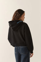 Women's Always Late Full Zip Hoodie in the color Black - Women's Back View