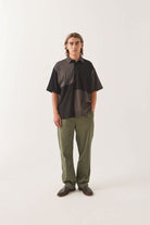 Men's Deco Relaxed Polo T-Shirt in the color Washed Black - Men's Front View