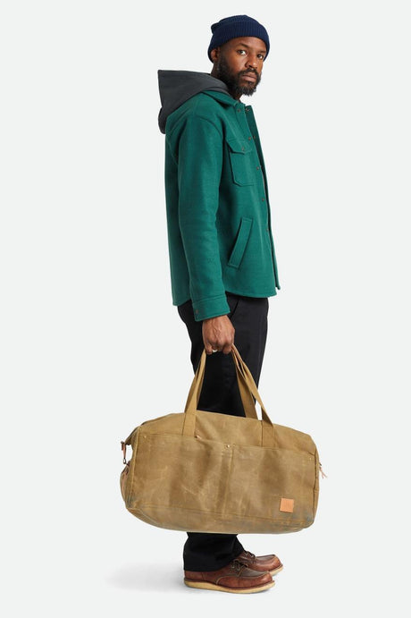 
       Brixton Unisex Traveler XL Weekender Duffle - Olive Brown | Front fit
     